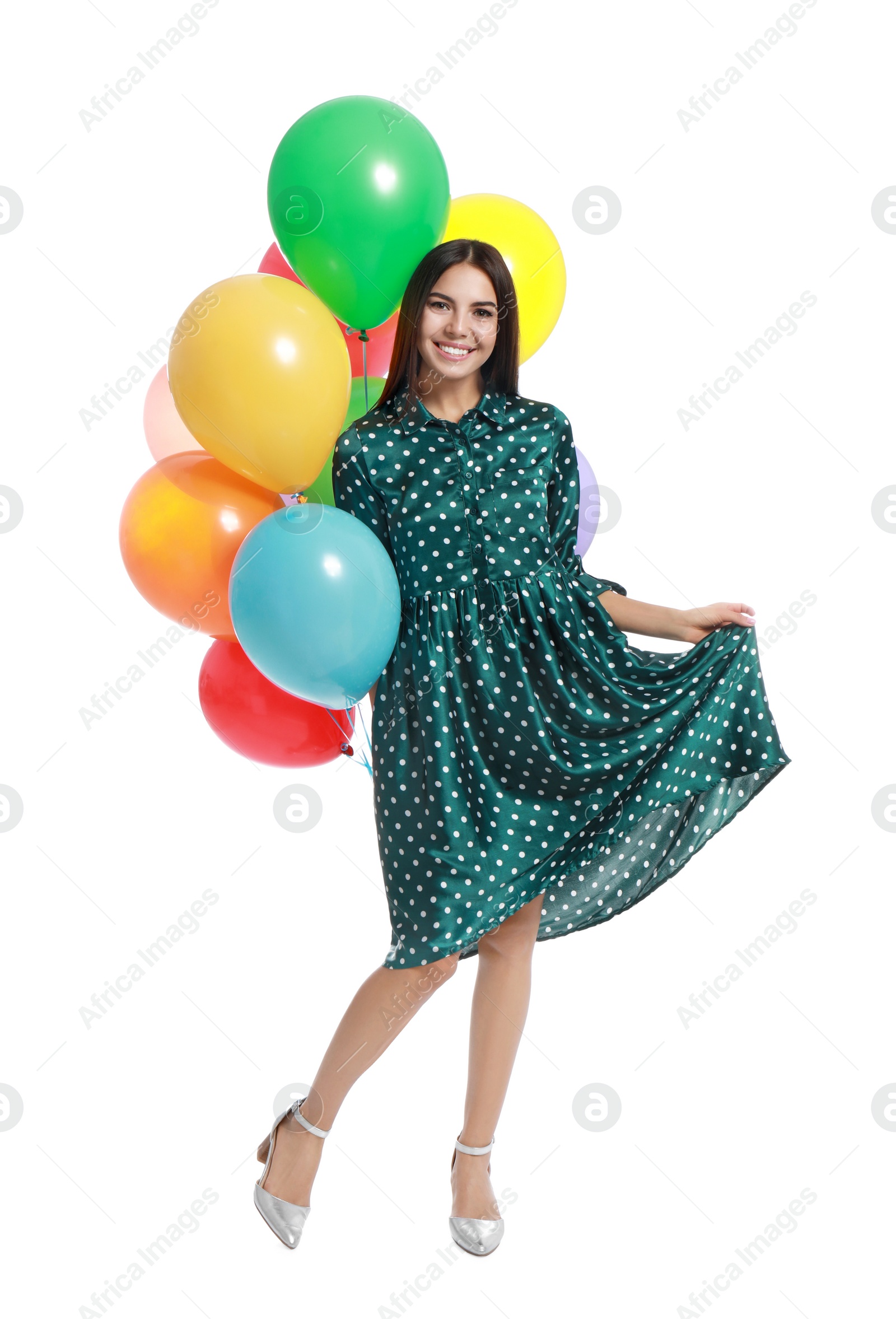 Photo of Young woman holding bunch of colorful balloons on white background