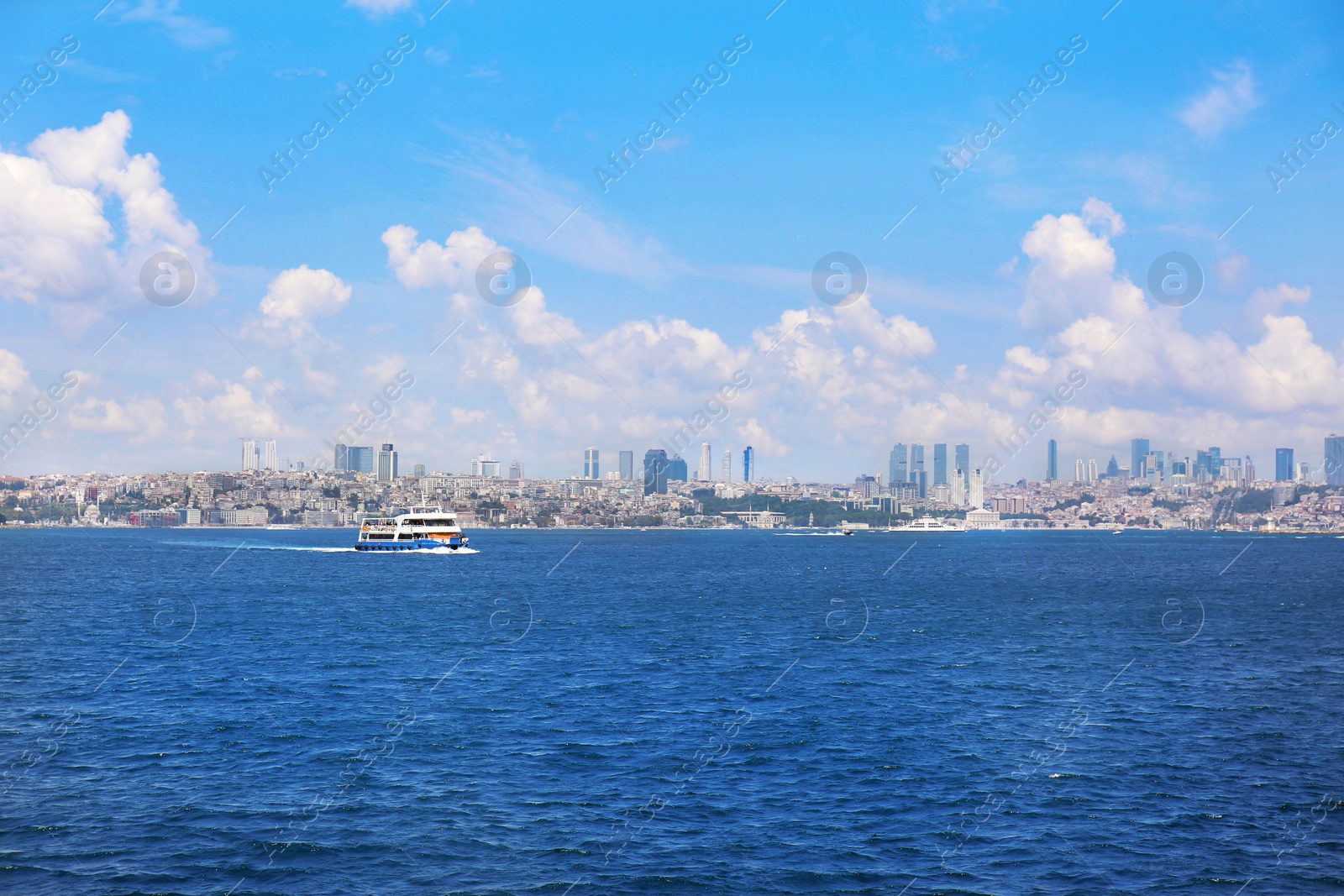 Photo of Beautiful view of ship in sea with city on background