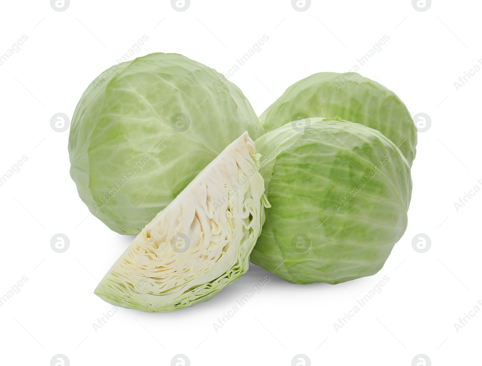 Photo of Whole and cut fresh ripe cabbages on white background