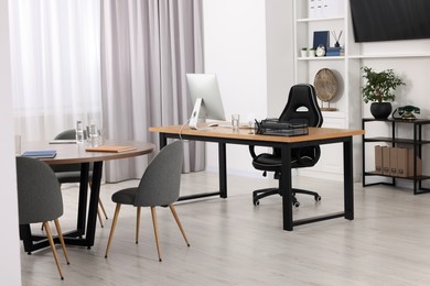 Photo of Stylish office with comfortable furniture. Interior design