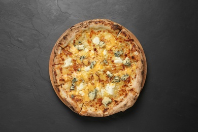 Image of Tasty cheese pizza on dark table, top view 