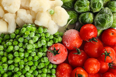 Photo of Different frozen vegetables as background, top view