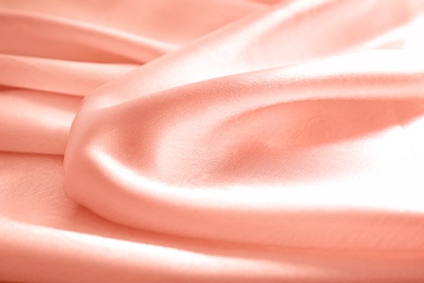 Photo of Texture of rose gold silk as background