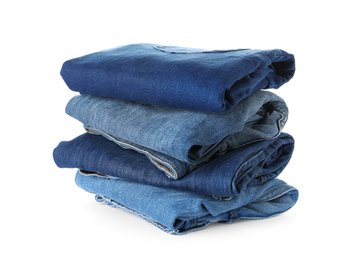 Stack of different jeans isolated on white