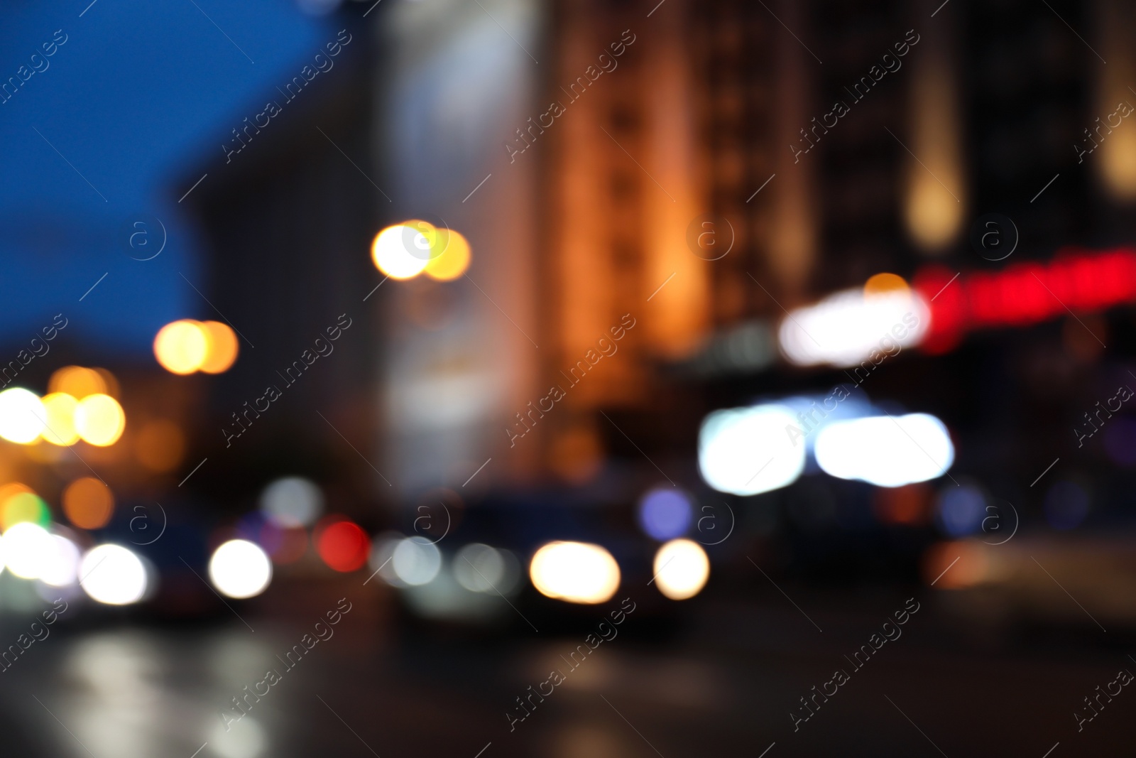 Photo of Blurred view of modern city at evening. Bokeh effect