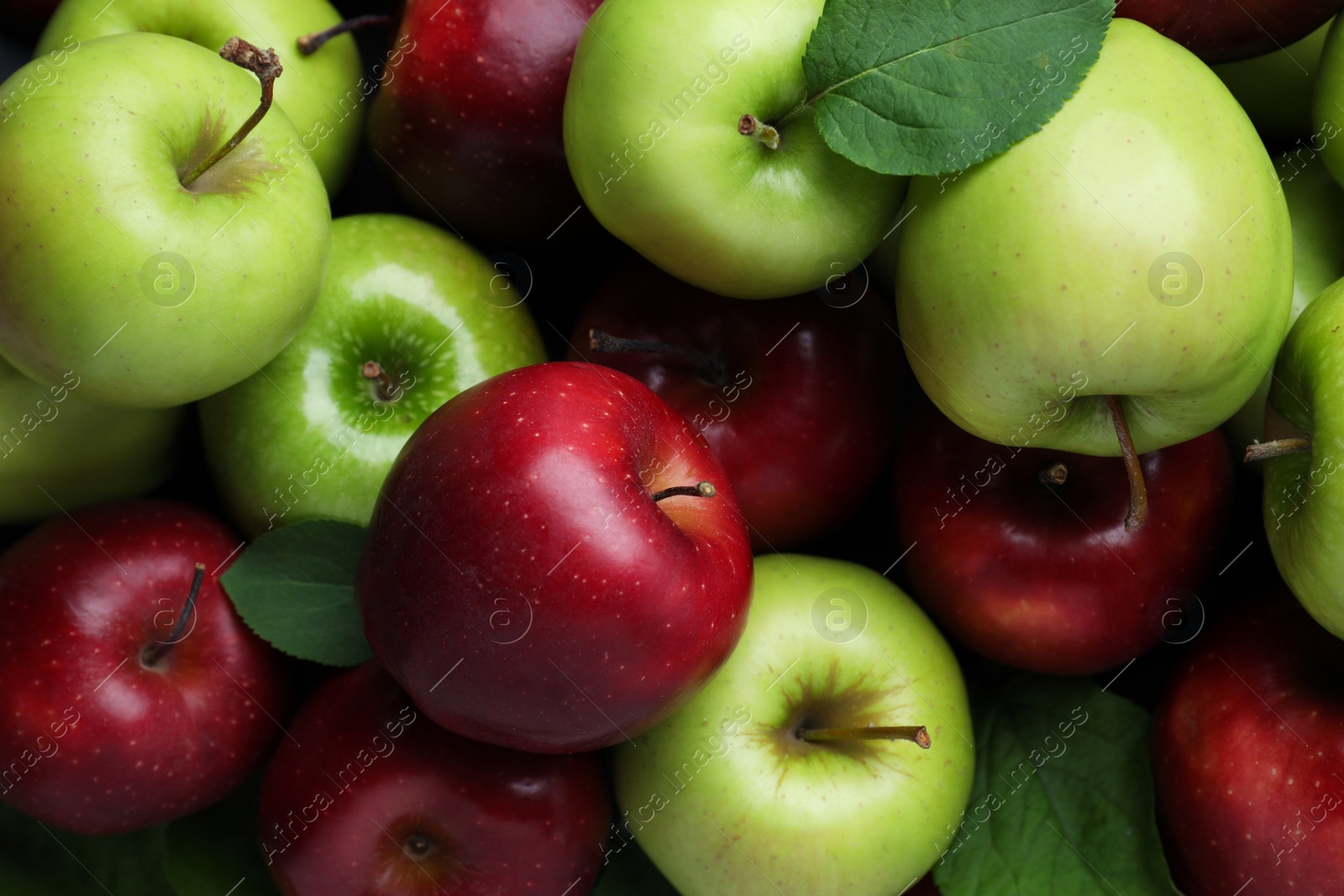 Photo of Fresh ripe green and red apples as background, top view