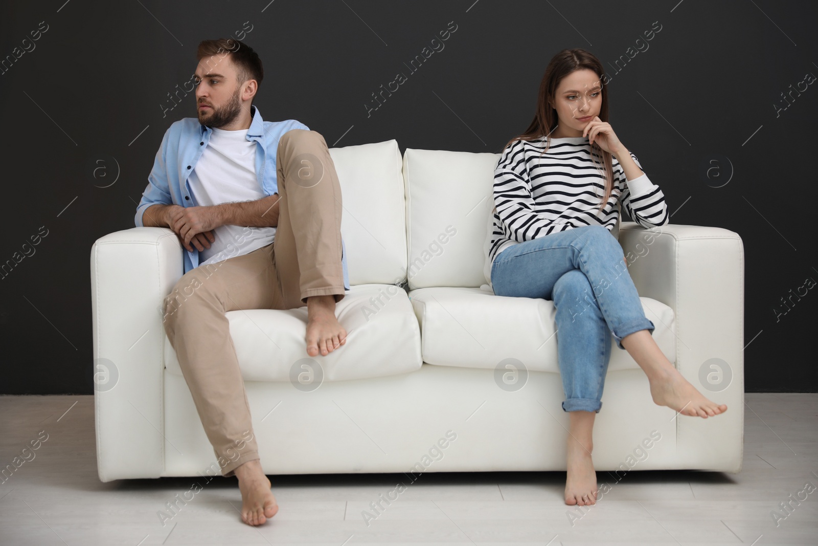 Photo of Unhappy couple with problems in relationship at home