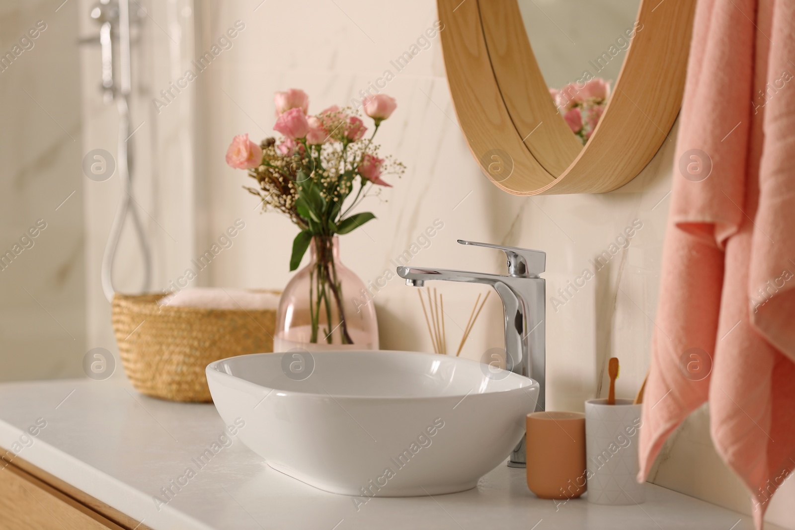 Photo of Modern bathroom interior with vessel sink and decor elements