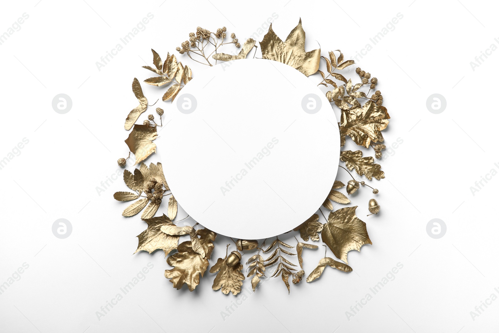 Photo of Frame made of different golden leaves on white background, flat lay with space for text. Autumn decor