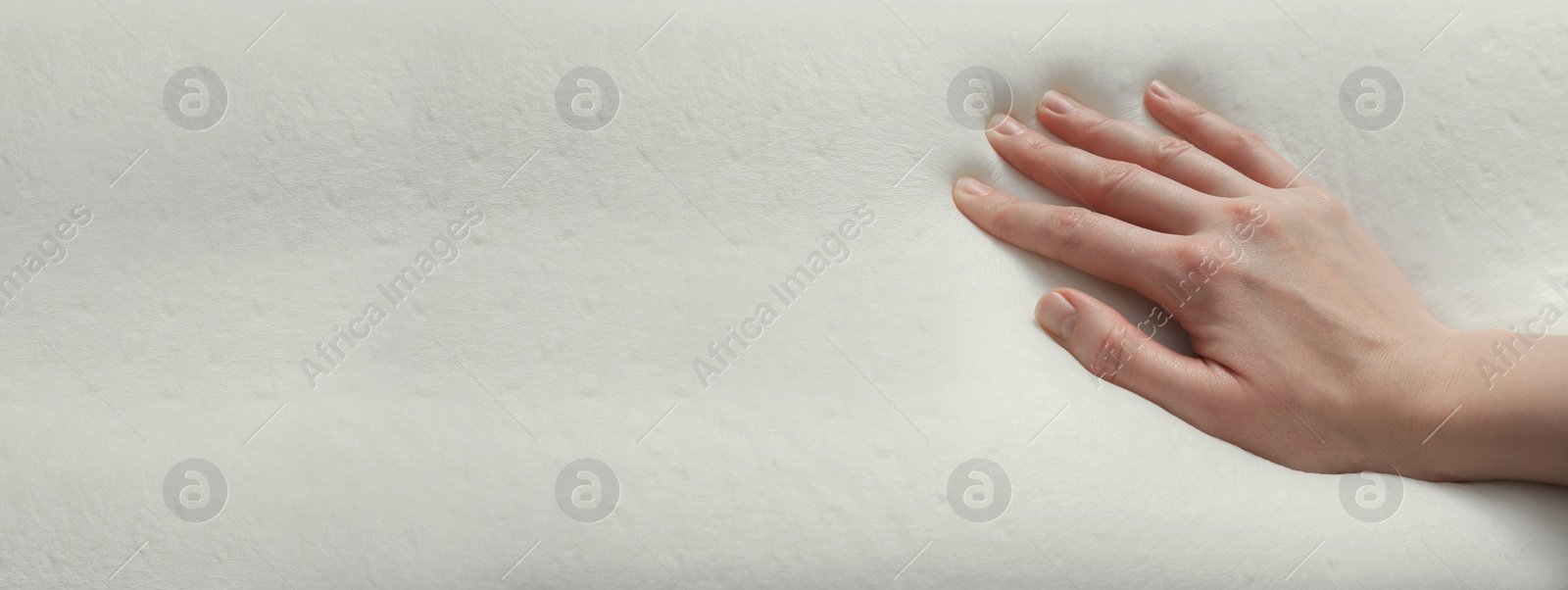 Image of Woman touching memory foam pillow, closeup. Banner design with space for text