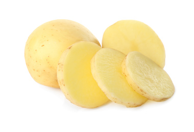 Photo of Whole and cut fresh raw organic potatoes on white background