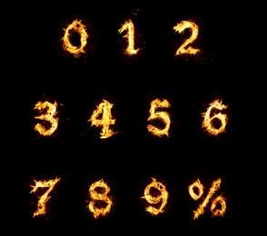 Image of Set of flaming numbers and percent symbol on black background