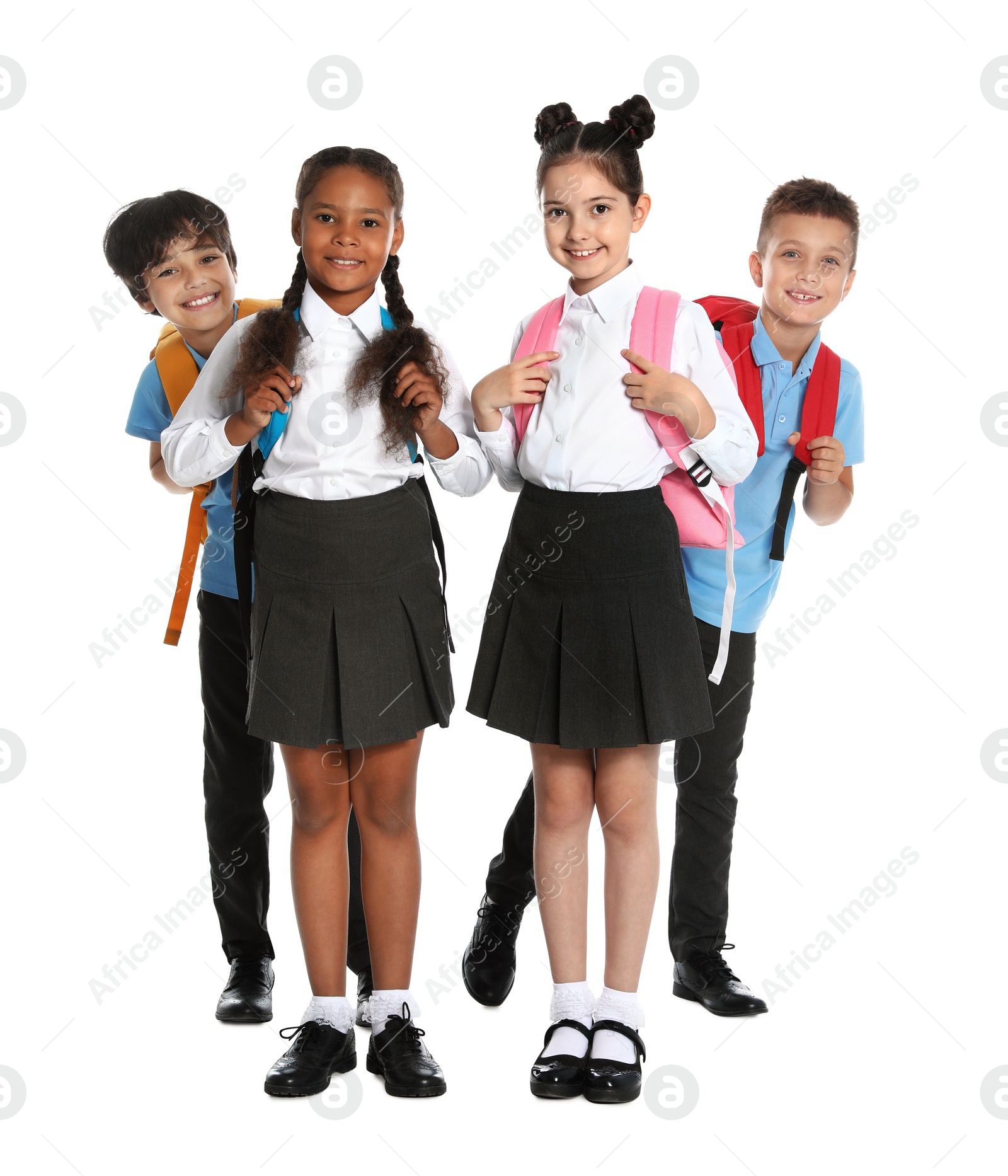 Photo of Happy children in school uniform on white background