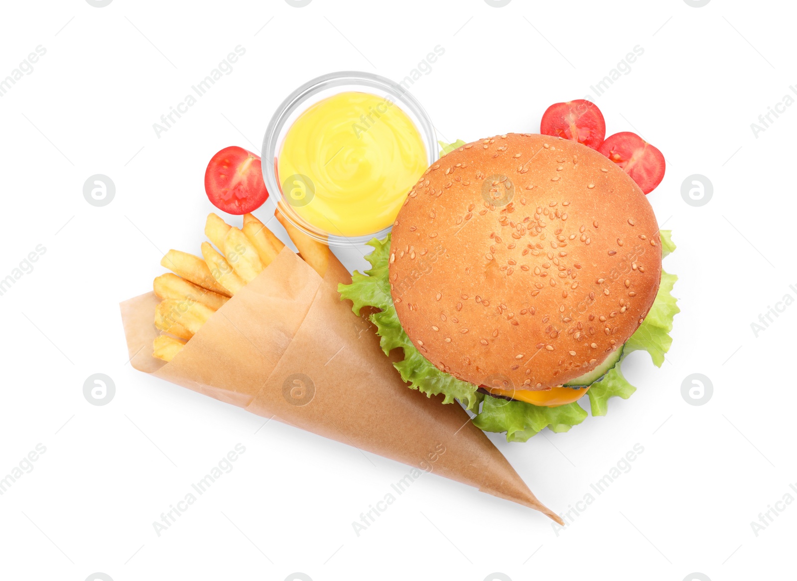 Photo of French fries, tasty burger and sauce on white background, top view