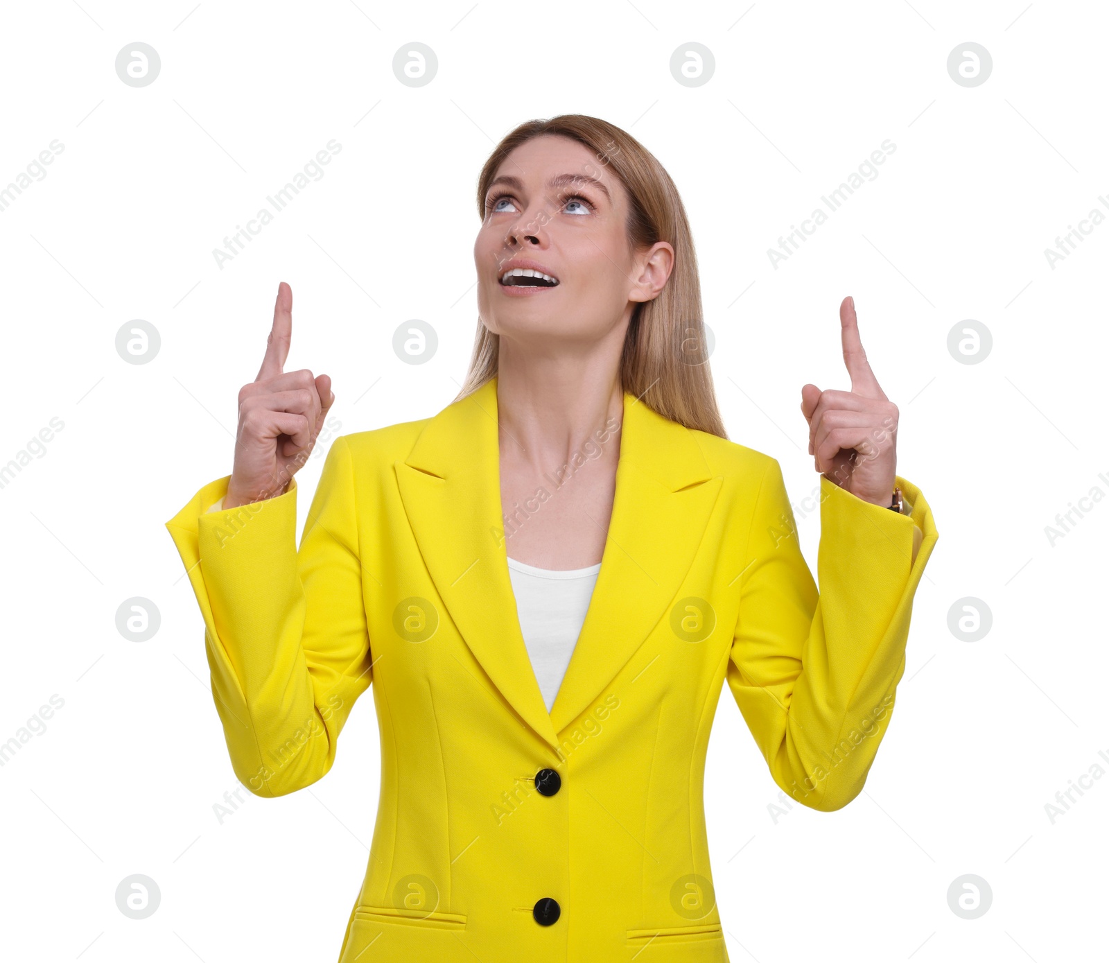 Photo of Beautiful happy businesswoman pointing at something on white background