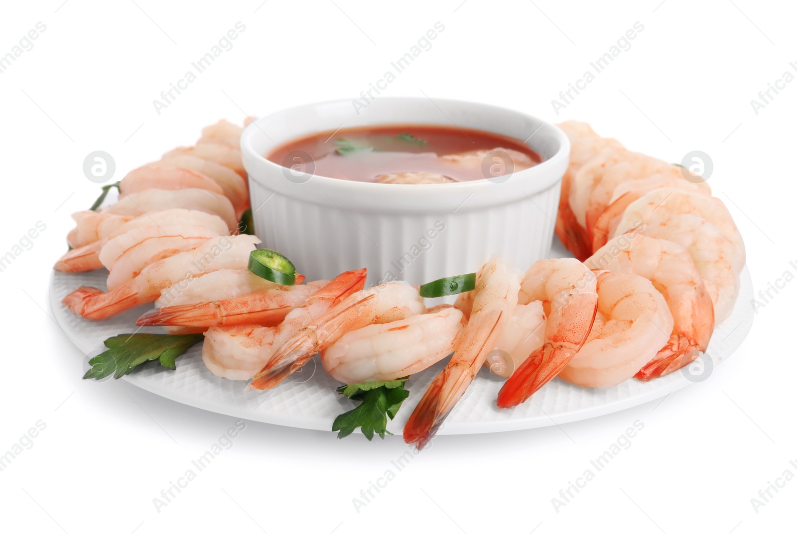 Photo of Tasty boiled shrimps with cocktail sauce, chili and parsley isolated on white