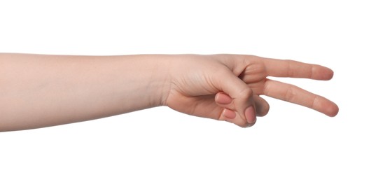 Playing rock, paper and scissors. Woman making scissors with her fingers on white background, closeup