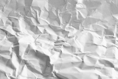 Photo of Crumpled sheet of paper as background, closeup