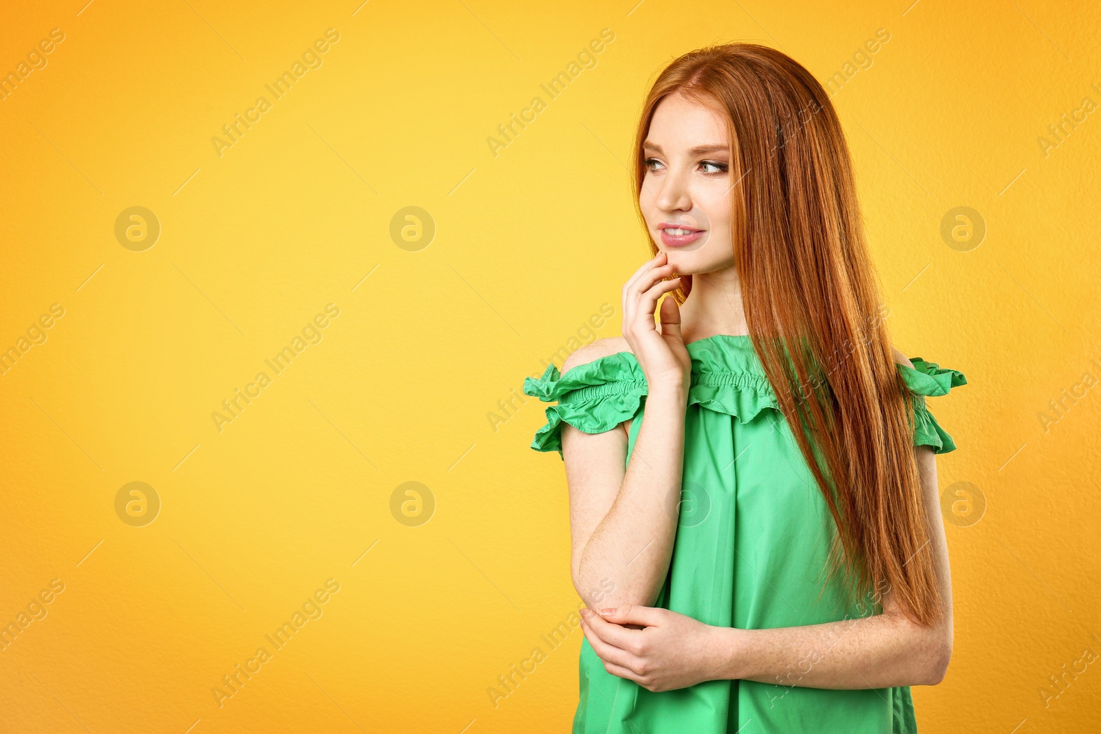 Photo of Portrait of young model with beautiful  hair on color background