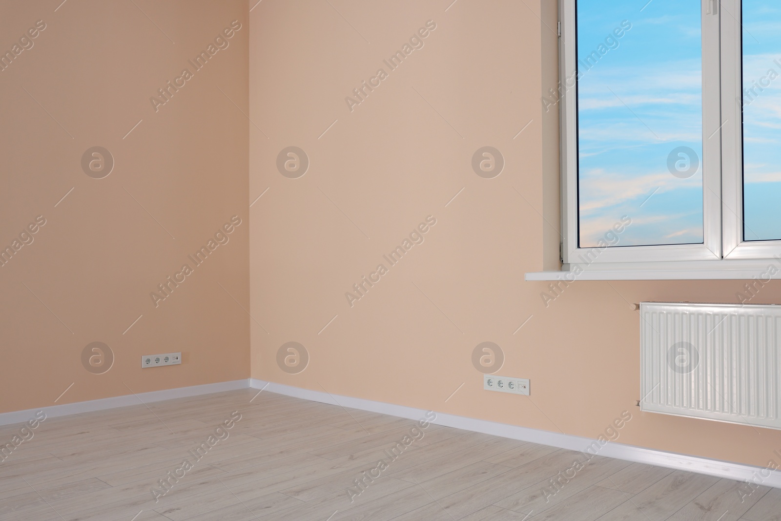 Photo of New empty room with clean windows and light walls