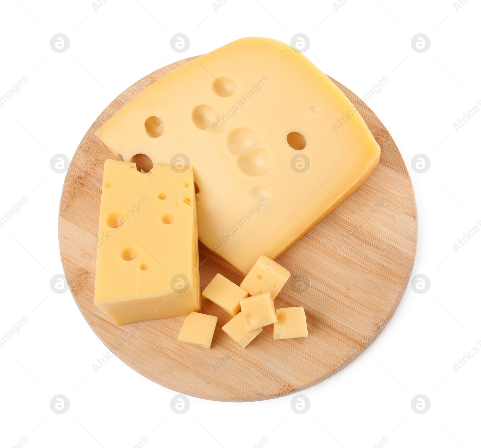 Photo of Cut fresh delicious cheese isolated on white, top view
