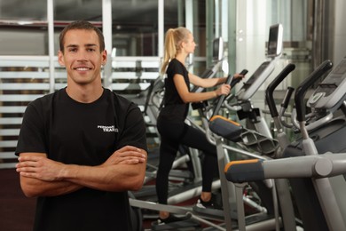Photo of Portraitpersonal trainer in modern gym
