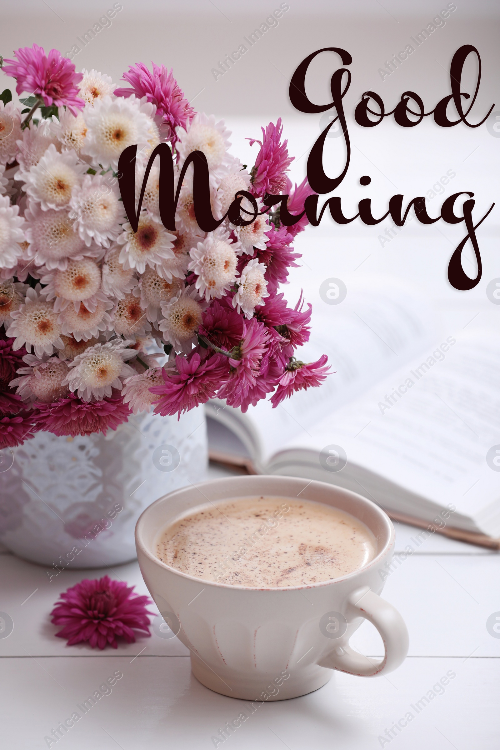 Image of Good morning! Cup of fresh coffee, open book and beautiful bouquet on white wooden table near window