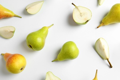 Photo of Fresh pears on light background, flat lay composition