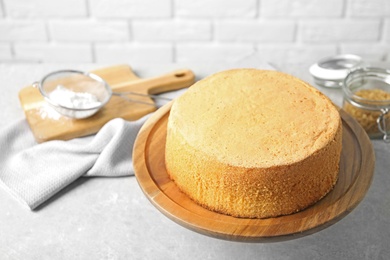 Photo of Delicious fresh homemade cake on light grey marble table