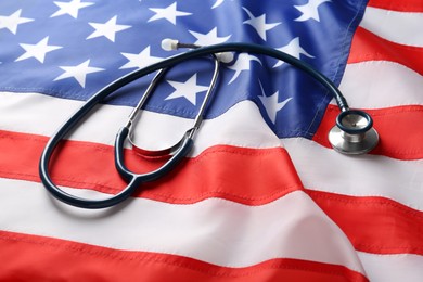 Photo of Closeup view of stethoscope on American flag