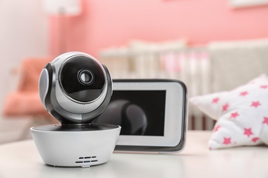 Baby monitors on table in room. CCTV equipment