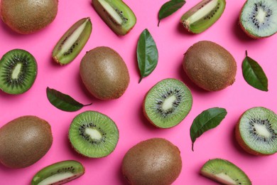 Flat lay composition with fresh ripe kiwis on pink background