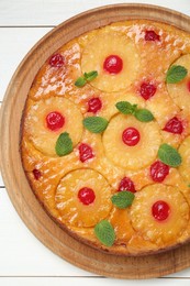 Photo of Delicious pineapple pie with cherry and mint on white wooden table, top view