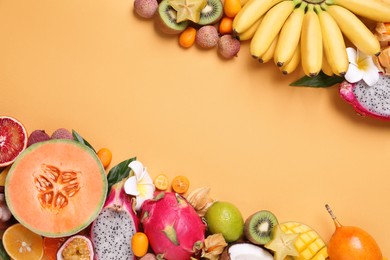 Photo of Different exotic fruits on beige background, flat lay. Space for text