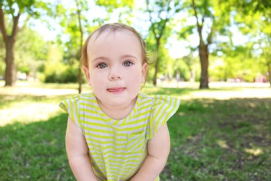 Portrait of cute baby girl in park on sunny day
