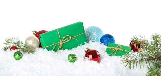 Photo of Christmas decoration with gift box on snow against white background