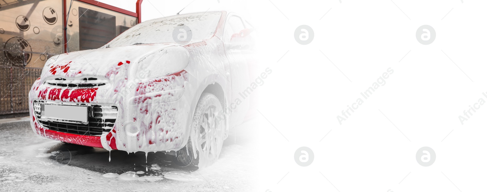 Image of Red auto with foam at car wash, space for text. Banner design