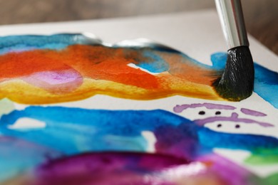 Photo of Painting with bright watercolor on paper, closeup view