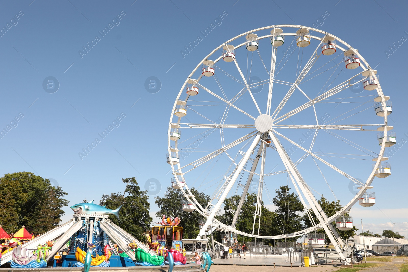 Photo of Darlowo, Poland - July 31 2022: Beautiful amusement park with ferris wheel on sunny day