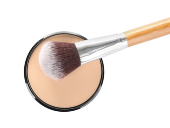 Photo of Face powder with brush on white background, top view. Makeup product