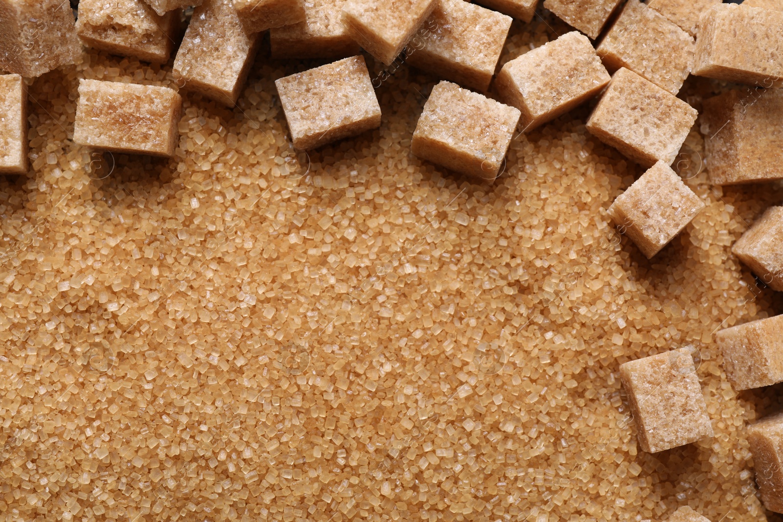 Photo of Different types of brown sugar as background, top view. Space for text