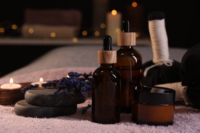 Photo of Composition with spa products and dry lavender flowers on soft light surface