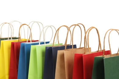 Photo of Colorful paper shopping bags on white background