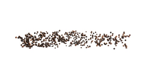 Photo of Scattered aromatic black peppercorns isolated on white