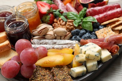 Photo of Many different tasty appetizers on table, closeup