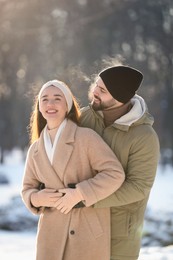 Photo of Beautiful young couple enjoying winter day outdoors