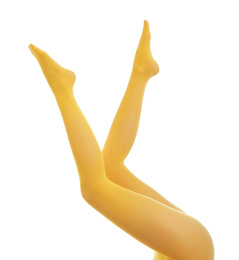 Photo of Woman wearing yellow tights on white background, closeup of legs