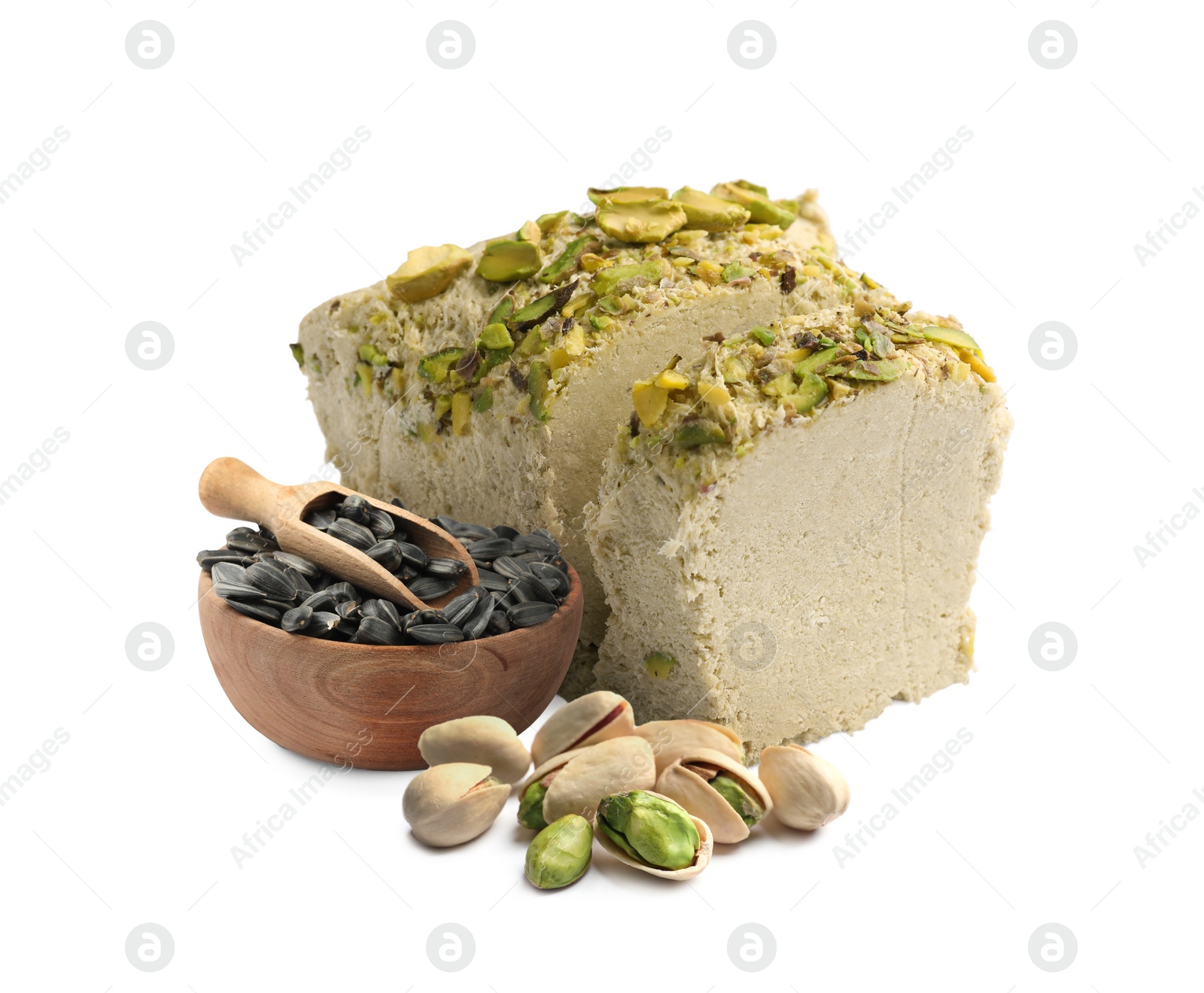 Image of Tasty halva, pistachio nuts and sunflower seeds isolated on white