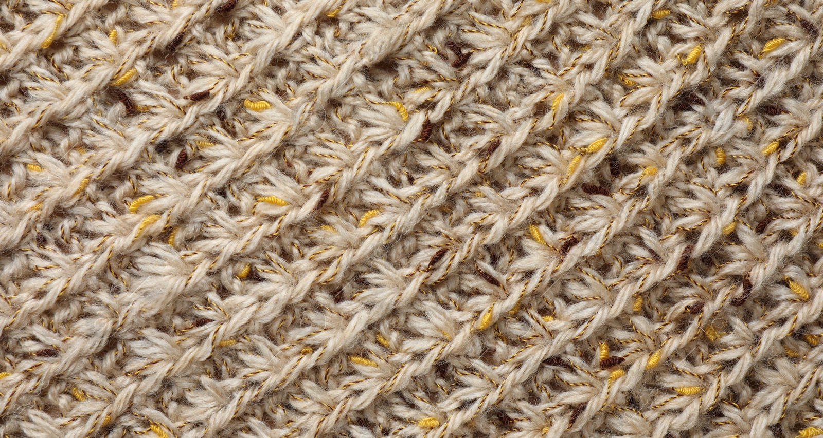 Photo of Texture of knitted fabric as background, top view