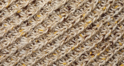 Photo of Texture of knitted fabric as background, top view